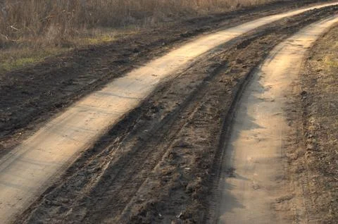 Bad muddy countriside road in spring Stock Photos
