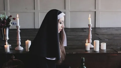 Bad nun drinking alcohol Stock Footage 75926073