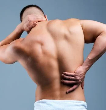 Bad posture affects more than your confidence. Rearview shot of an Stock Photos