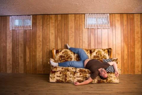 Bad sleep on a couch Stock-Fotos