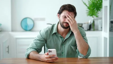 Bad sms news, device problem, mobile app crash concept. Young Hispanic man using Stock Footage 220873952