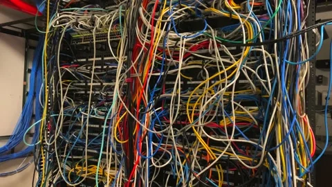 Bad terrible comm network closet server rack cable wire management mess. Stock-Footage 133225932