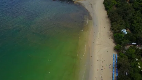 Bad water condition at tropical beach, waste and drainage outflow to sea, aerial Stock Footage