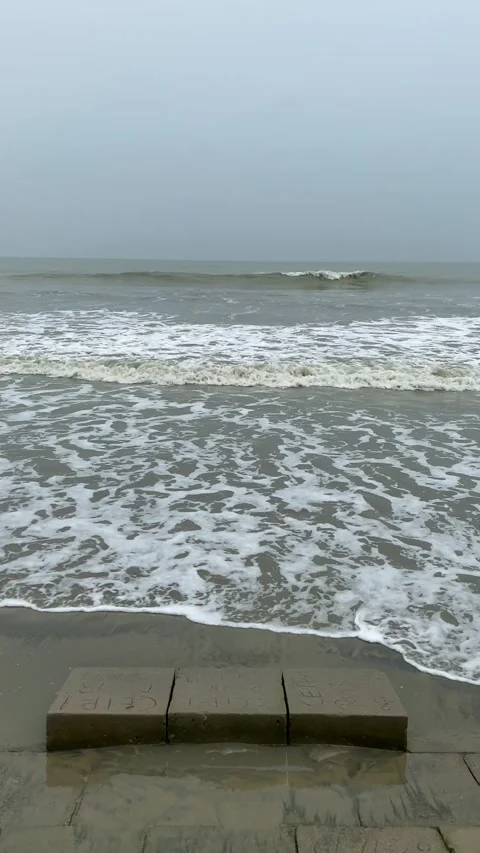 Bad weather causing powerful sea waves under overcast storm sky - vertical Stock Footage 341557364