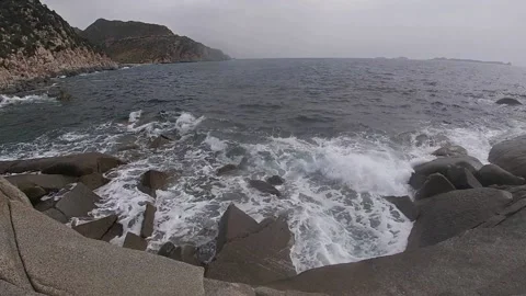 Bad weather on the coasts with strong wind and waves crashing on the rocks Stock Footage 158041911