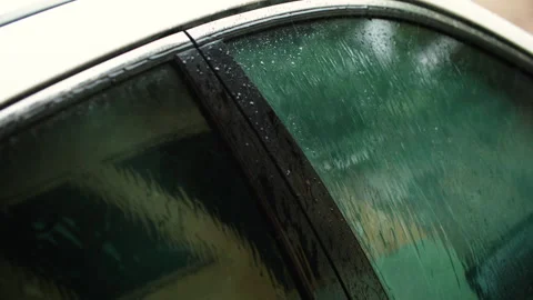 Bad weather. Rain drops hitting car glass. Video stock 345830200