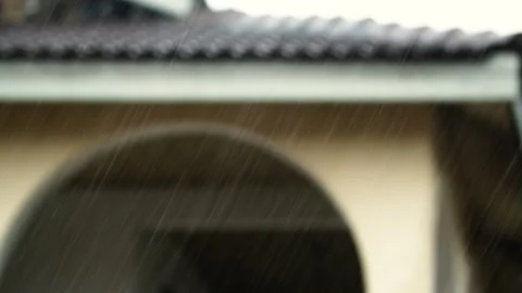 Bad weather, rains drops with blurred house in background. Video stock 345830558