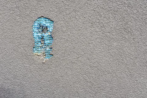 Bad work. Hole in the plastered wall from fallen plaster Stock Photos