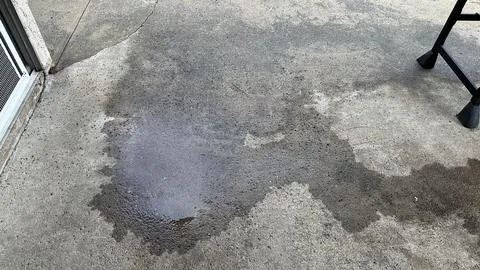 Bad workmanship on a brick patio leaving puddles Stock Photos