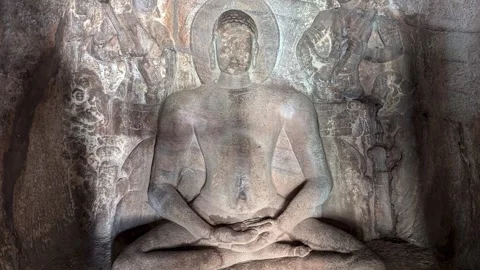 Badami- 04 Oct, 2024; Lord Mahavira’s Rock-Cut Sculpture with Attendants in cave Stock Footage 303569353