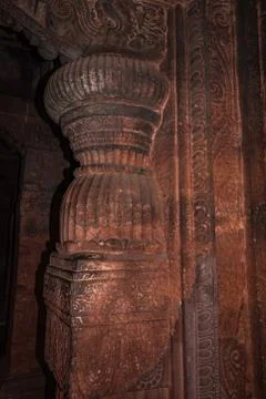 Badami cave temple interior pillars stone art in details Фото