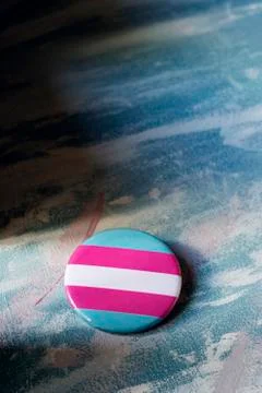 Badge patterned with a transgender pride flag Stock Photos