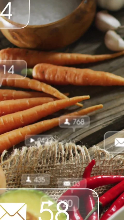 Badges popping over thin carrots on table, play, mail, follower counts changing, 스톡 동영상 331047505
