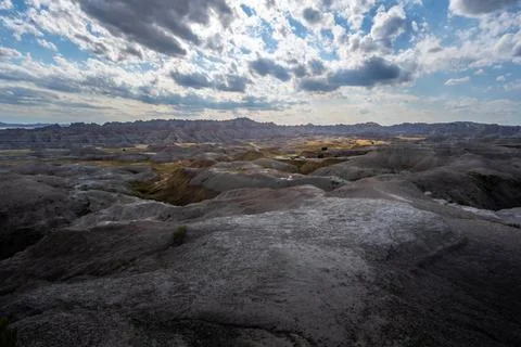 Badlands Canyon Landscape Under Dramatic Cloudy Sky in Badlands NP, South D.. Stock Photos