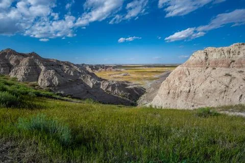 Badlands Canyon Landscape Under Dramatic Cloudy Sky in Badlands NP, South D.. Stock Photos