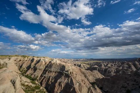 Badlands Canyon Landscape Under Dramatic Cloudy Sky in Badlands NP, South D.. Stock Photos