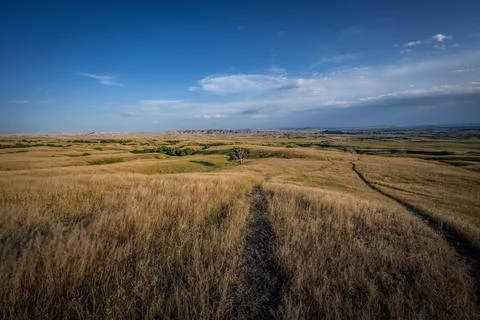 Badlands Canyon Landscape Under Dramatic Cloudy Sky in Badlands NP, South D.. Stock Photos
