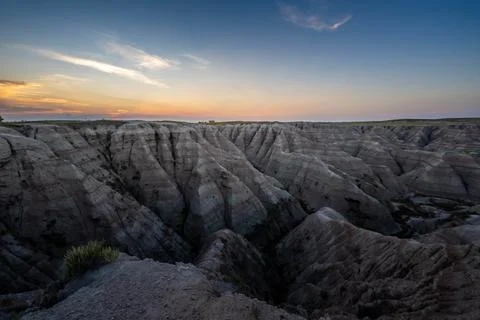 Badlands Canyon Landscape Under Dramatic Cloudy Sky in Badlands NP, South D.. Stock Photos