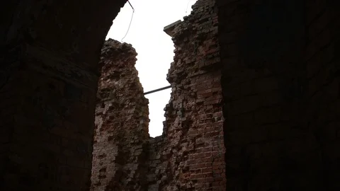 Badly damaged brick wall, view past the arch Stock Footage 122238480