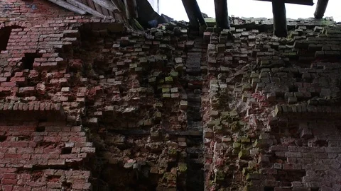 Badly damaged wall and part of the ceiling of an old building Stock Footage 122238487