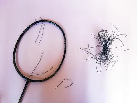 Badminton racket with a broken strings,on color background Foto stock