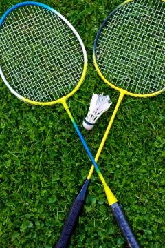 Badminton racket on grass Stock Photos