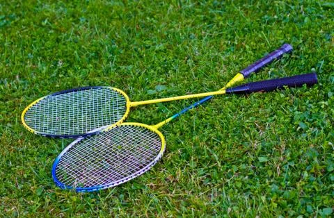 Badminton racket on grass Stock Photos
