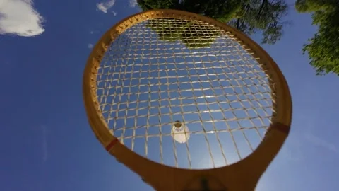 Badminton racket hitting shuttlecock in mid-air close-up Stock Footage 336508245