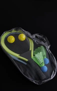 Badminton set rests inside a mesh carry bag Stock Photos