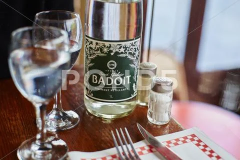 Badoit bottle in french restaurant Stock Photos