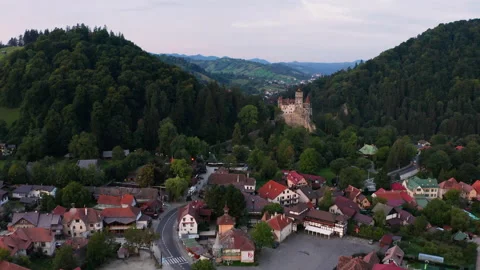 BAerial view of Bran Castle at sunset. Dracula's castle in Transylvania, Romania Stock Footage 163744915
