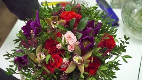 Baeutiful bouquet in the red box on the table Stock Footage 73945864