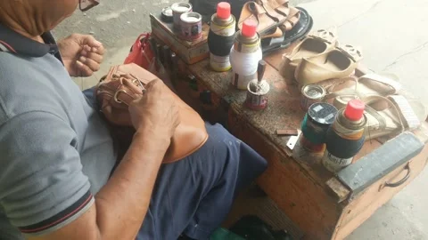 Bag and shoe tailor Stock Footage 256883078