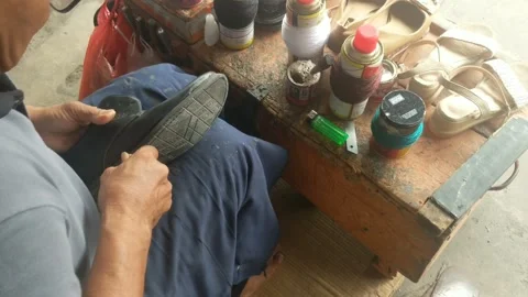Bag and shoe tailor Stock Footage 256883272