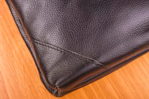 Of the bag, the angle of the triangle; brown leather texture Stock Photos