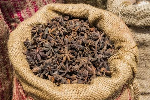 Bag of Chinese Star Anise background at market Stock Photos