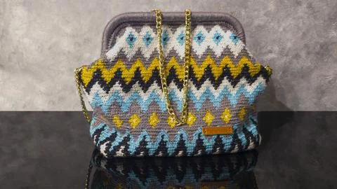 Bag crocheted from multi-colored threads. Yellow with gray, black and other c Foto stock