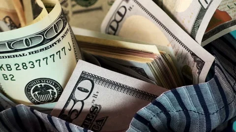 Bag with dollars on a blue background Stock Footage 67829780