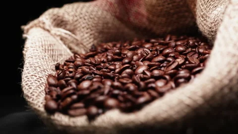 Bag full of coffee beans with rack focus Stock Footage 208767247