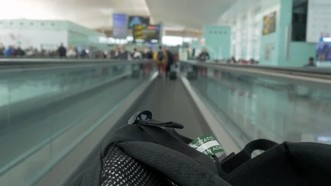 Bag with Hand luggage Tag in the Automatic Track of an Airport Stock Footage 107577774