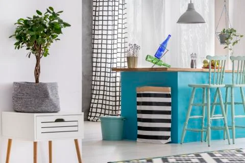 Bag lying by kitchen island Stock Photos
