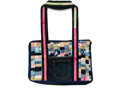Bag made of fabric patchwork on a white background. 스톡 사진