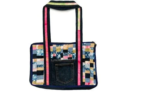 Bag made of fabric patchwork on a white background. Beautiful women s bag ... 스톡 사진