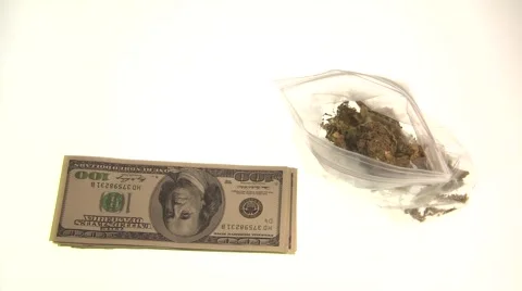 Bag of marijuana and US bills thrown again Stock Footage