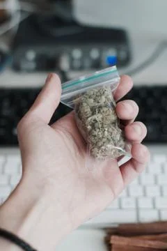 Bag with a marijuana in hand Foto stock