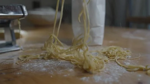 A bag of noodles is being pulled out of a machine Stock Footage 305983459