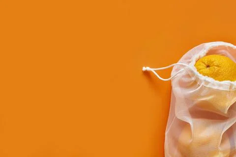 Bag with orange and drawstring, small eco sack made from natural cotton fabric Stock Photos