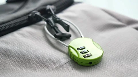 A bag secured with a three-digit combination lock for added safety Stock Footage 346339950