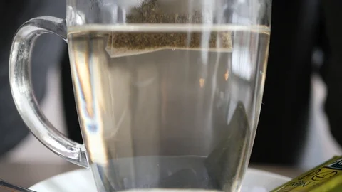 A bag of tea in a cup of water Video stock 103106298