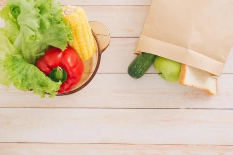 Bag with vegetables in kitchen Stock Photos